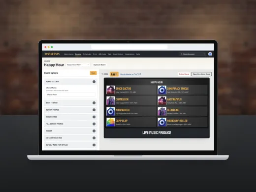 The Boards page of the Live Tap Lists dashboard on a laptop, with Board Options on the left and a live preview of a Happy Hour menu board with a bottom promo